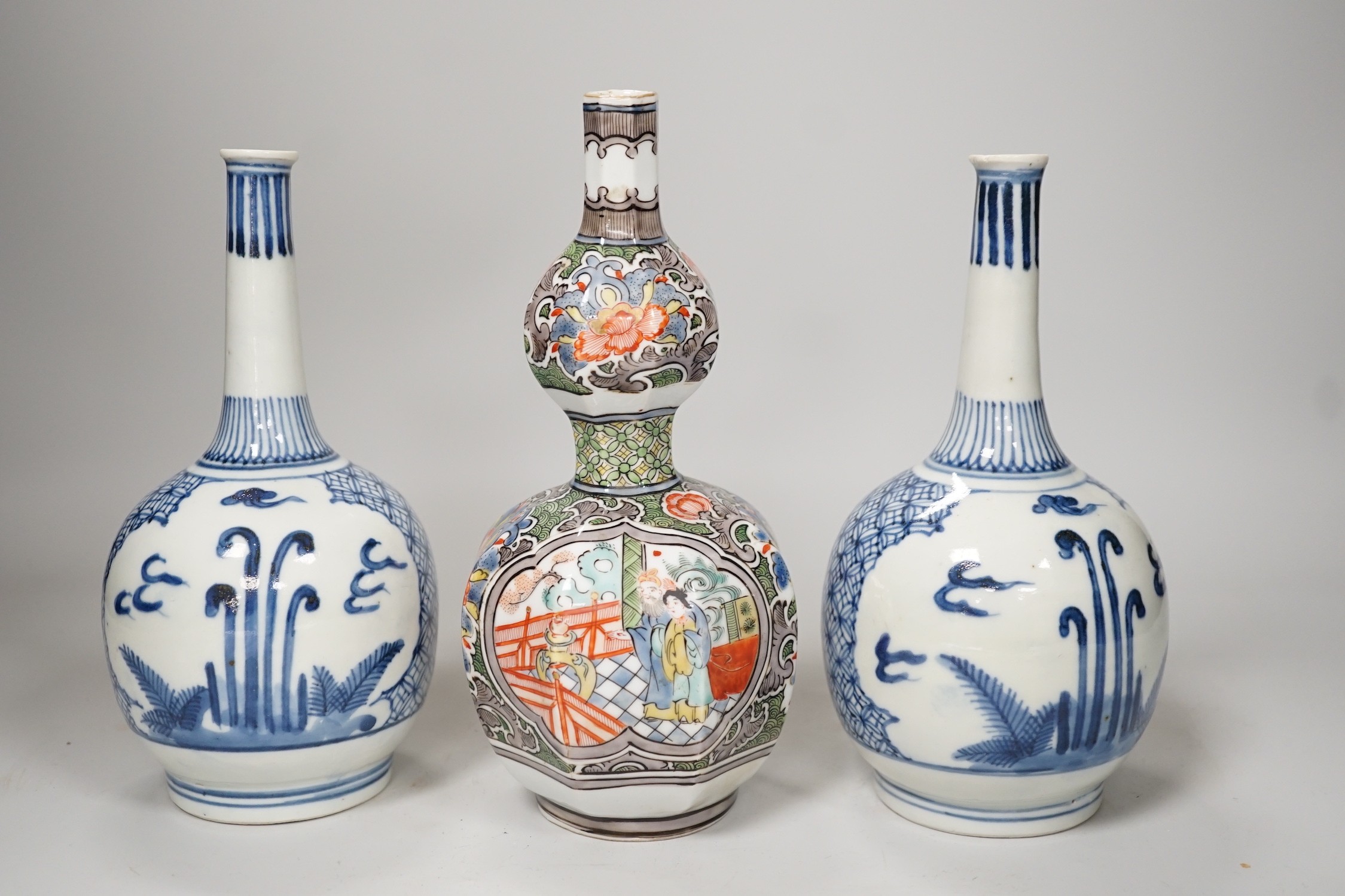 A Chinese famille verte octagonal double gourd vase, together with a pair of Chinese blue and white bottle vases, tallest 20cm